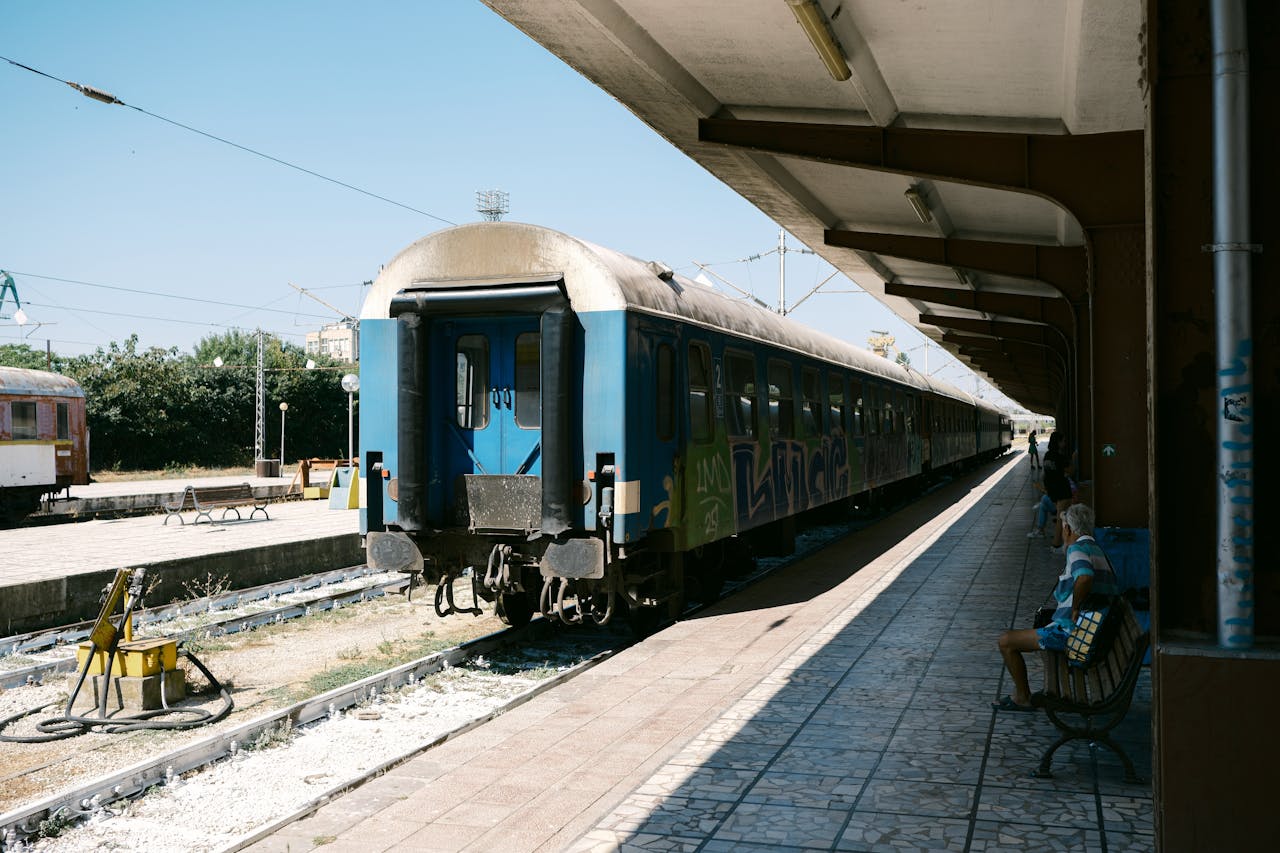A train sits at Varna station on a bright summer day. Capture of daily life in Bulgaria.